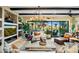 Living room with built-in shelving, fireplace, and large windows at 40903 N Harbour Town Way, Anthem, AZ 85086