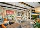 Spacious living room features exposed wooden beams, a large TV, and comfortable seating at 40903 N Harbour Town Way, Anthem, AZ 85086