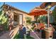 Covered patio with comfortable seating and heater at 40903 N Harbour Town Way, Anthem, AZ 85086