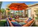 Outdoor patio furniture with a large umbrella at 40903 N Harbour Town Way, Anthem, AZ 85086