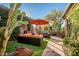 Relaxing patio with orange couches and cacti at 40903 N Harbour Town Way, Anthem, AZ 85086