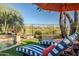 Poolside lounge chairs overlooking the backyard at 40903 N Harbour Town Way, Anthem, AZ 85086