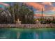 Stunning pool and fire features at dusk at 40903 N Harbour Town Way, Anthem, AZ 85086