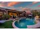 Resort-style backyard oasis with a pool and spa at 40903 N Harbour Town Way, Anthem, AZ 85086