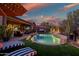 Beautiful pool and patio at sunset at 40903 N Harbour Town Way, Anthem, AZ 85086