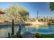 Luxury pool with desert landscaping and stone accents at 40903 N Harbour Town Way, Anthem, AZ 85086