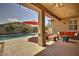 View of a refreshing pool from a covered patio with comfortable seating at 183 W Evergreen Pear Ave, Queen Creek, AZ 85140