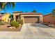 Charming home featuring a well-maintained front yard, desert landscaping, and an attached two-car garage at 12364 W Rosewood Ln, Peoria, AZ 85383