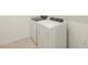 Bright laundry room with washer and dryer included at 22478 W Tonopah Dr, Surprise, AZ 85387