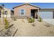 Charming house with gray garage door and drought-tolerant landscaping at 22502 W Tonopah Dr, Surprise, AZ 85387