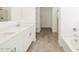 Bathroom with double vanity, shower, and a soaking tub at 22514 W Tonopah Dr, Surprise, AZ 85387