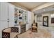 Stylish bar area with white cabinetry, wine refrigerator, and comfortable seating at 2744 S First Water Ln, Gold Canyon, AZ 85118