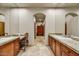 Spacious bathroom with dual sinks, granite countertops, and framed mirrors at 2744 S First Water Ln, Gold Canyon, AZ 85118