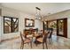 Elegant dining room featuring stylish lighting, an outdoor view, and seamless access to outdoor space at 2744 S First Water Ln, Gold Canyon, AZ 85118