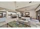 Expansive living room with travertine floors and seamless flow to the kitchen and dining area at 2744 S First Water Ln, Gold Canyon, AZ 85118