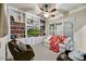 Relaxing living room has built in bookshelves, white sofas, and a ceiling fan at 2744 S First Water Ln, Gold Canyon, AZ 85118