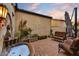 Outdoor patio has brick flooring, stone water fountain, and comfortable seating at 2744 S First Water Ln, Gold Canyon, AZ 85118