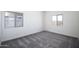 Cozy bedroom with neutral carpet and bright natural light at 24579 W St Catherine Ave, Buckeye, AZ 85326