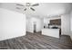 Open concept living space with ceiling fan and wood-look flooring at 24579 W St Catherine Ave, Buckeye, AZ 85326