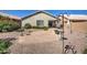 Backyard view with gravel, plants, and bird baths at 29205 N Yellow Bee Dr, San Tan Valley, AZ 85143