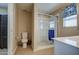 Modern bathroom with a walk-in shower and tiled flooring at 29205 N Yellow Bee Dr, San Tan Valley, AZ 85143