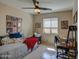 Charming bedroom featuring a daybed, window blinds, and a workspace at 29205 N Yellow Bee Dr, San Tan Valley, AZ 85143