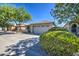 House exterior with a two-car garage and neatly landscaped yard at 29205 N Yellow Bee Dr, San Tan Valley, AZ 85143