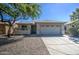 Single-story house with a two-car garage and landscaped front yard at 29205 N Yellow Bee Dr, San Tan Valley, AZ 85143