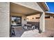 Covered patio with table and chairs, great for outdoor dining at 29205 N Yellow Bee Dr, San Tan Valley, AZ 85143