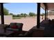 Covered patio overlooks large backyard with golf course view at 3939 S Veronica Ln, Gold Canyon, AZ 85118