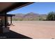 Spacious desert backyard features a mountain view with neutral-toned perimeter wall at 3939 S Veronica Ln, Gold Canyon, AZ 85118