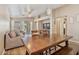 Open floorplan showing the living and dining rooms, with lots of natural light and neutral colored paint at 1448 E Poncho Ln, San Tan Valley, AZ 85143