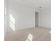 Carpeted bedroom with bright natural light and a modern aesthetic at 11937 W Parkway Ln, Avondale, AZ 85323