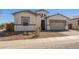 An exterior view of a single story home with a two car garage at 11937 W Parkway Ln, Avondale, AZ 85323