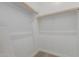 Spacious walk-in closet with carpet and built-in shelving, offering ample storage space at 11937 W Parkway Ln, Avondale, AZ 85323