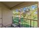 Private balcony overlooking a tree-lined landscape at 7101 W Beardsley Rd # 122, Glendale, AZ 85308