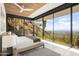 Serene bedroom with floor-to-ceiling windows providing breathtaking views of the desert landscape and city skyline at 4301 E Upper Ridge Way, Paradise Valley, AZ 85253