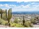Scenic view of the city and desert landscape with iconic saguaro cacti in the foreground, clear blue skies above at 4301 E Upper Ridge Way, Paradise Valley, AZ 85253
