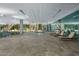 Luxury building's indoor pool and lounge area, with a view of the fitness center at 7141 E Rancho Vista Dr # 2011, Scottsdale, AZ 85251