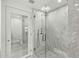 Glass enclosed shower featuring sleek fixtures and marble walls at 7141 E Rancho Vista Dr # 2011, Scottsdale, AZ 85251