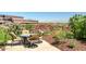 This delightful patio includes mountain views, colorful flowers, and a table with four chairs for seating at 7161 E Rancho Vista Dr # 6001, Scottsdale, AZ 85251