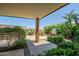 A well-maintained patio area with lush landscaping, a grill, and an outdoor dining set offers a delightful outdoor experience at 7161 E Rancho Vista Dr # 6001, Scottsdale, AZ 85251