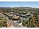 Beautiful aerial view of an upscale neighborhood with well-manicured lawns and desert landscaping at 2425 W Bronco Butte Trl # 1002, Phoenix, AZ 85085