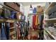 Walk-in closet with an organized shelving and hanging system for optimal storage at 2425 W Bronco Butte Trl # 1002, Phoenix, AZ 85085
