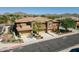 A desert home featuring a terracotta tile roof and a three-car garage at 2425 W Bronco Butte Trl # 1002, Phoenix, AZ 85085