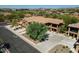 Aerial view of a luxurious multi-story home featuring a three-car garage and well-maintained landscaping at 2425 W Bronco Butte Trl # 1002, Phoenix, AZ 85085