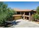 A stunning two-story house featuring a terracotta tile roof and a three-car garage at 2425 W Bronco Butte Trl # 1002, Phoenix, AZ 85085