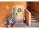 Charming entryway with a decorated front door, plants, and inviting decor, offering a warm welcome at 2425 W Bronco Butte Trl # 1002, Phoenix, AZ 85085