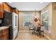 Bright eat-in kitchen area with stainless steel refrigerator, breakfast table, and lots of natural light at 2425 W Bronco Butte Trl # 1002, Phoenix, AZ 85085