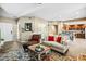 Inviting living room featuring neutral tones, stylish furnishings, and tile floors for a warm ambiance at 2425 W Bronco Butte Trl # 1002, Phoenix, AZ 85085